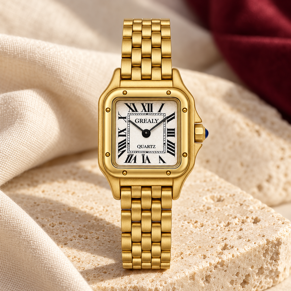 Gold-tone Grealy watch on ivory stone with burgundy fabric